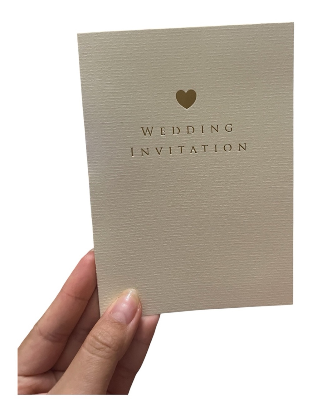 Cream wedding invitation card with gold heart and text